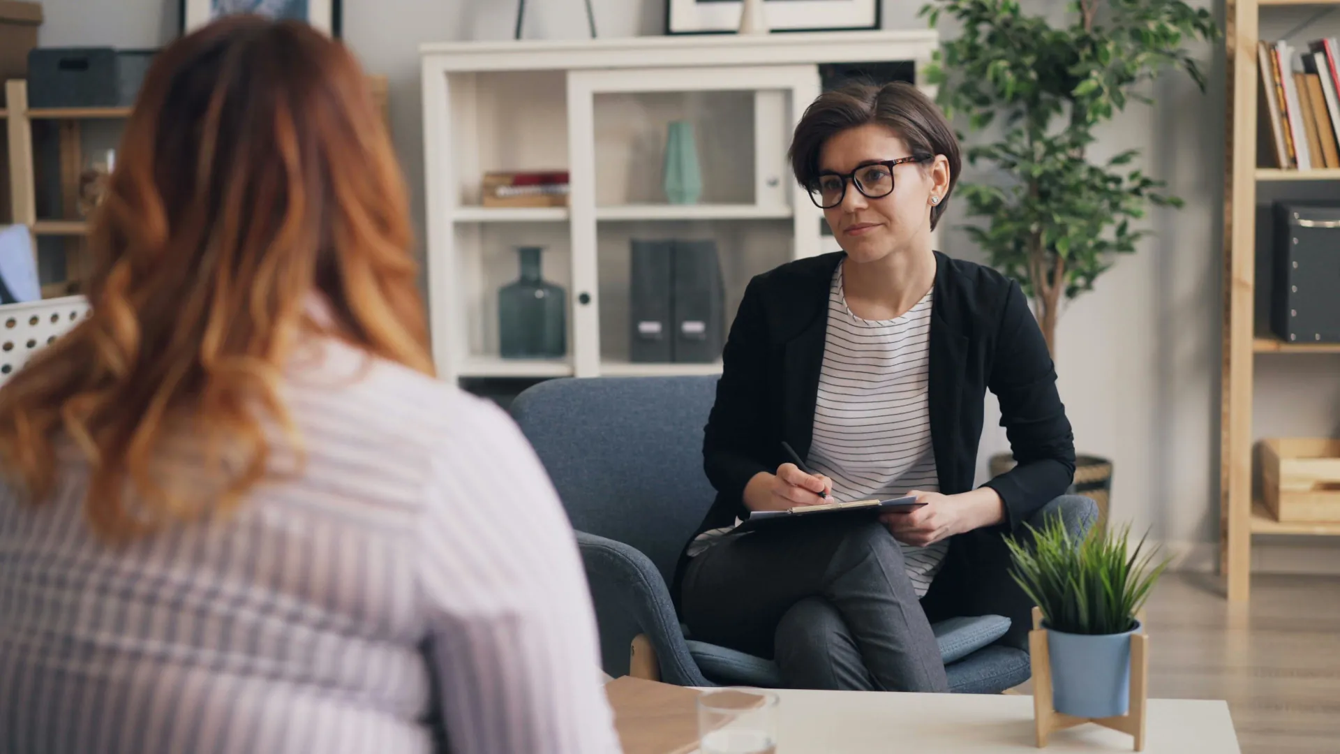 A young couple are receiving relationship advice from their counsellor.
