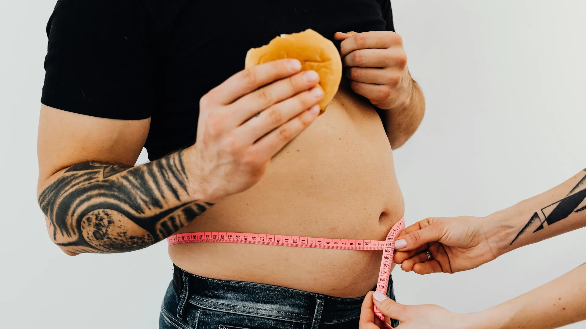 A young male is getting his weight measured as part of a treatment plan.